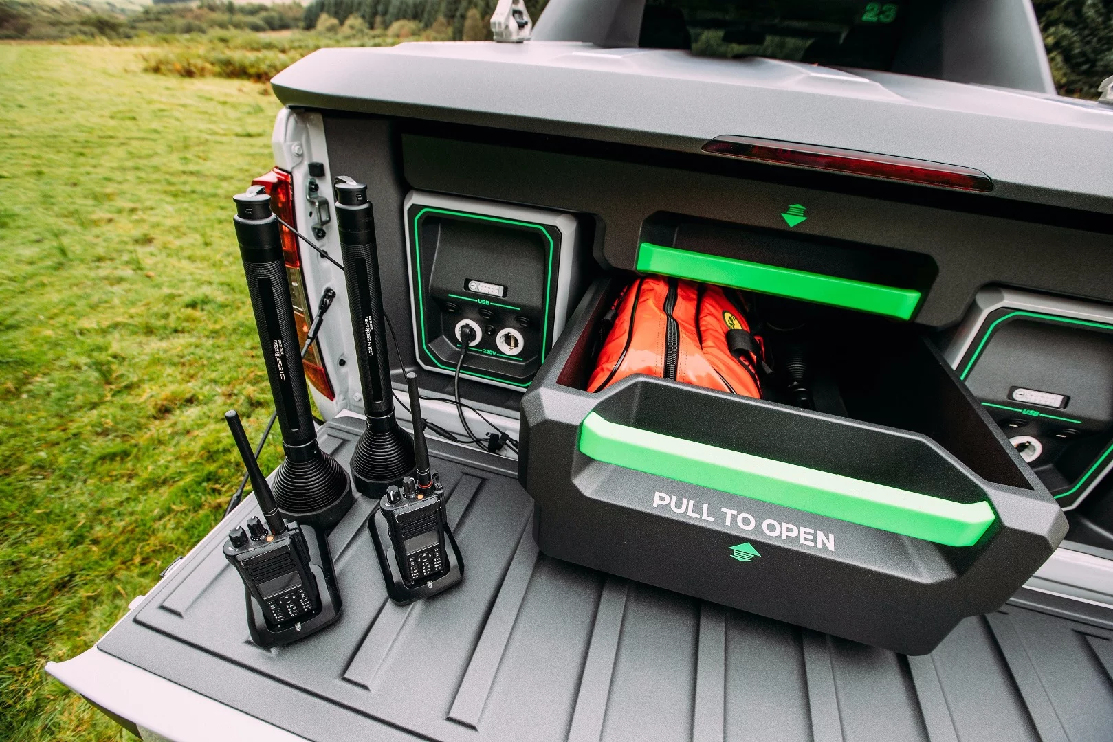 Dual portable power packs flank storage drawers