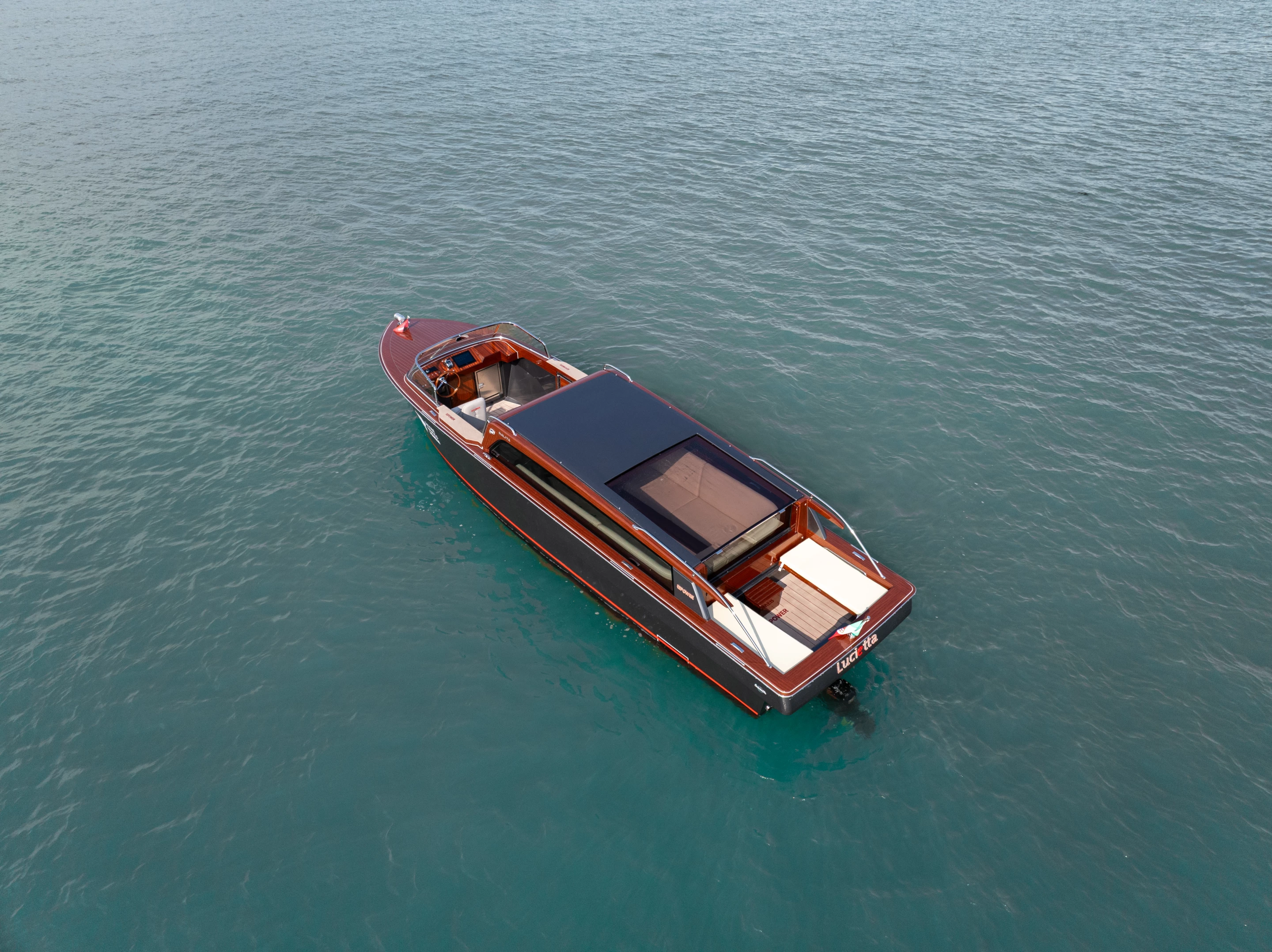 Top view of the Lucietta shows bench seating at the stern, a covered mid-section that's partly shaded and the open area up front for the "taxi driver"