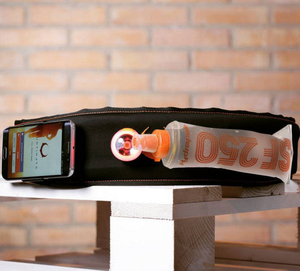 The Runtimate belt with smartphone, light and water bottle