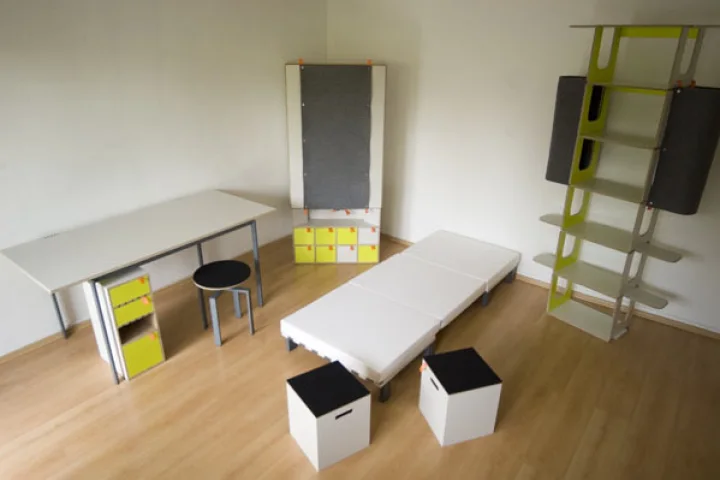 Casulo contains an armoire cupboard, desk table and cabinet, height-adjustable revolving chair, two stools and a bed with mattress