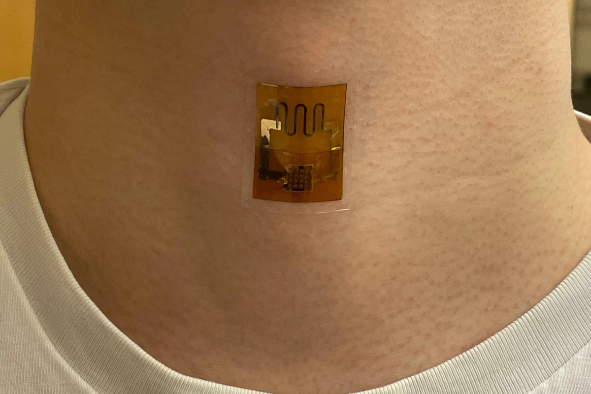The UMass biofilm power source, built into a skin patch with a strain sensor designed to track swallowing motions