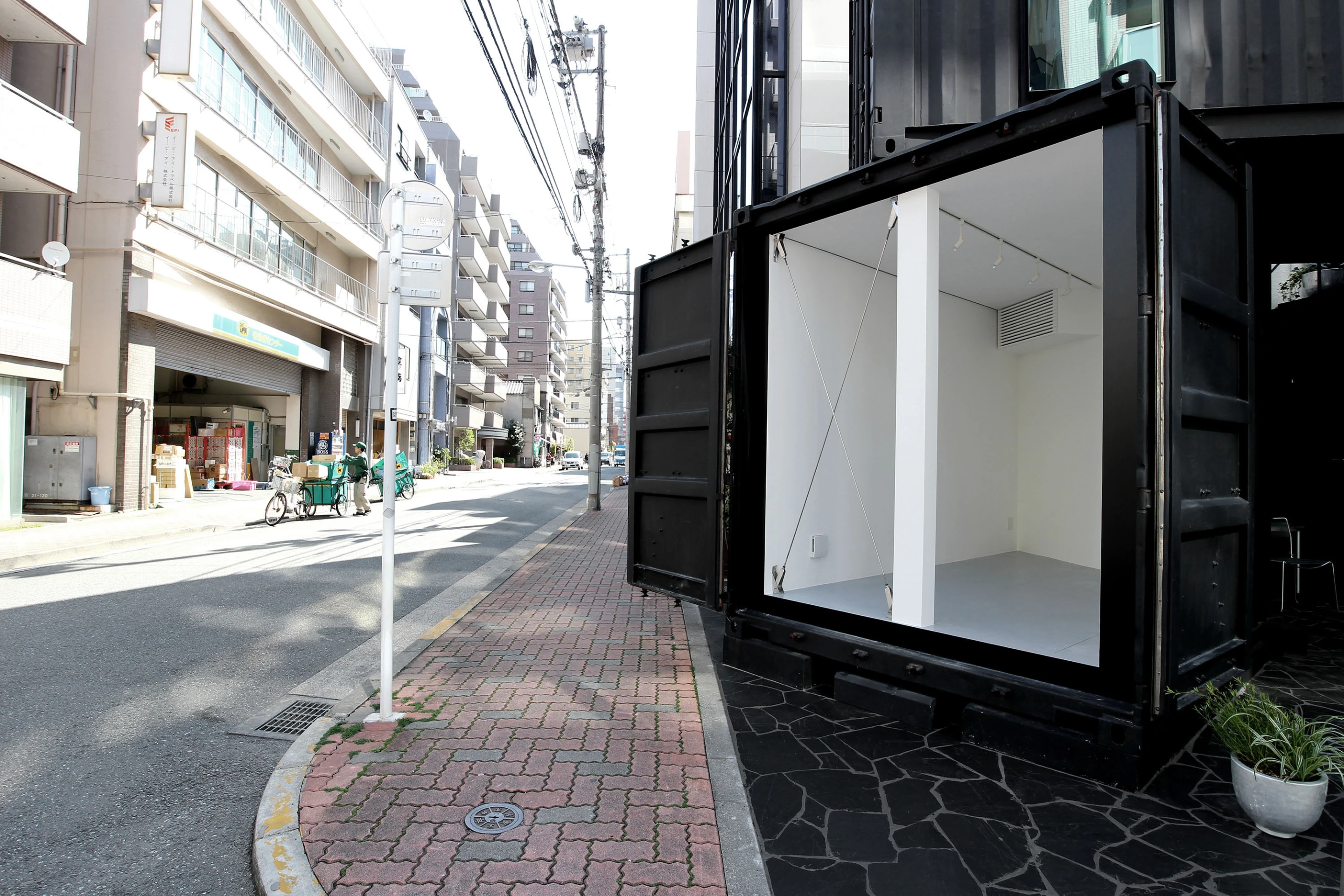 Large hatched door opens out onto the street