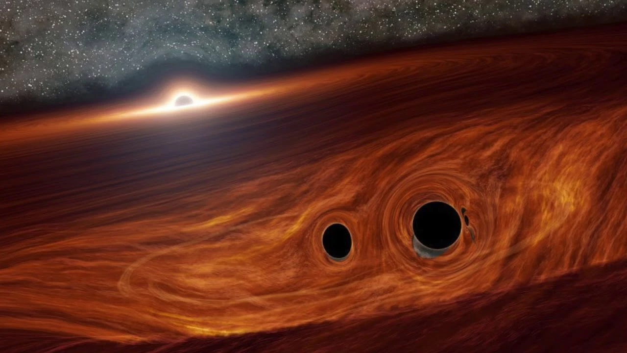 An artist's imagining of the two black holes about to merge, located inside the debris disk of a supermassive black hole