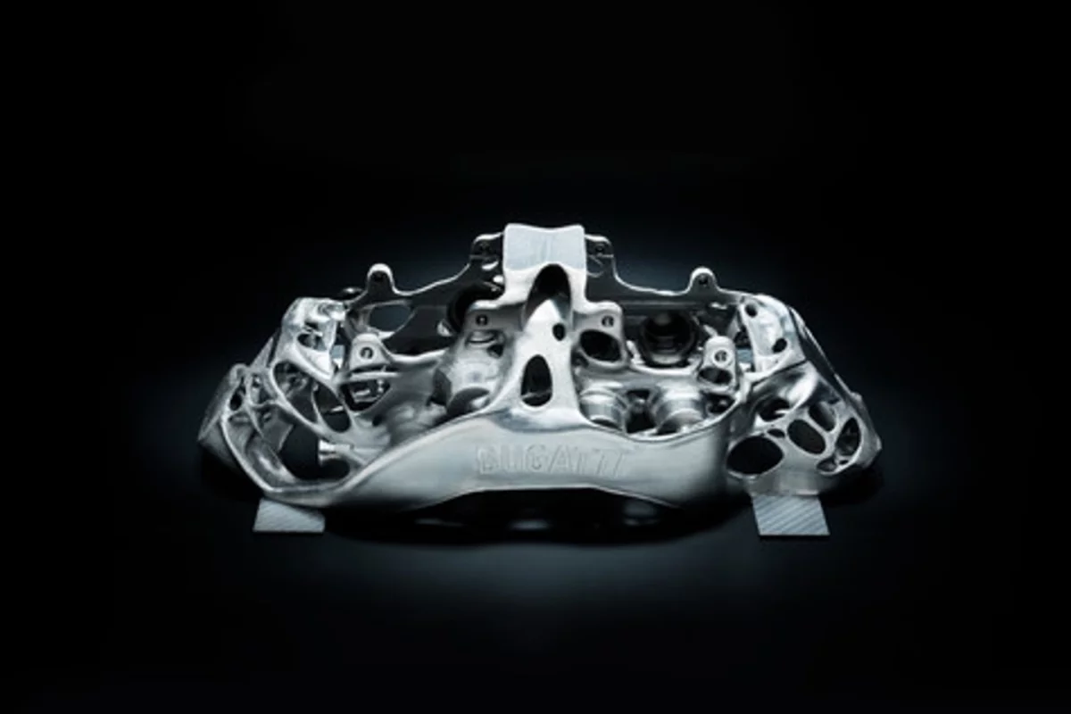This eight-piston monobloc brake caliper developed by Bugatti is the world’s first brake caliper to be produced by 3-D printer