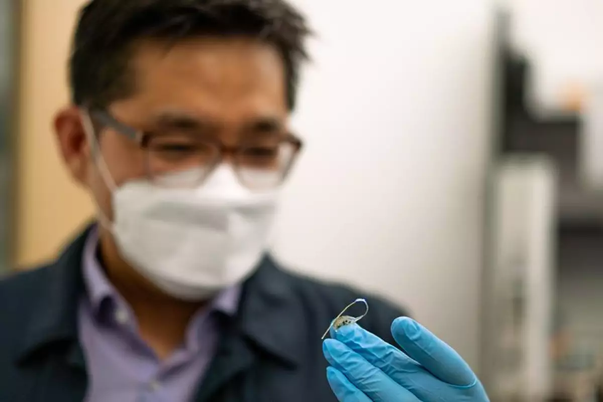 Asst. Prof. Sung Il Park with the prototype implant