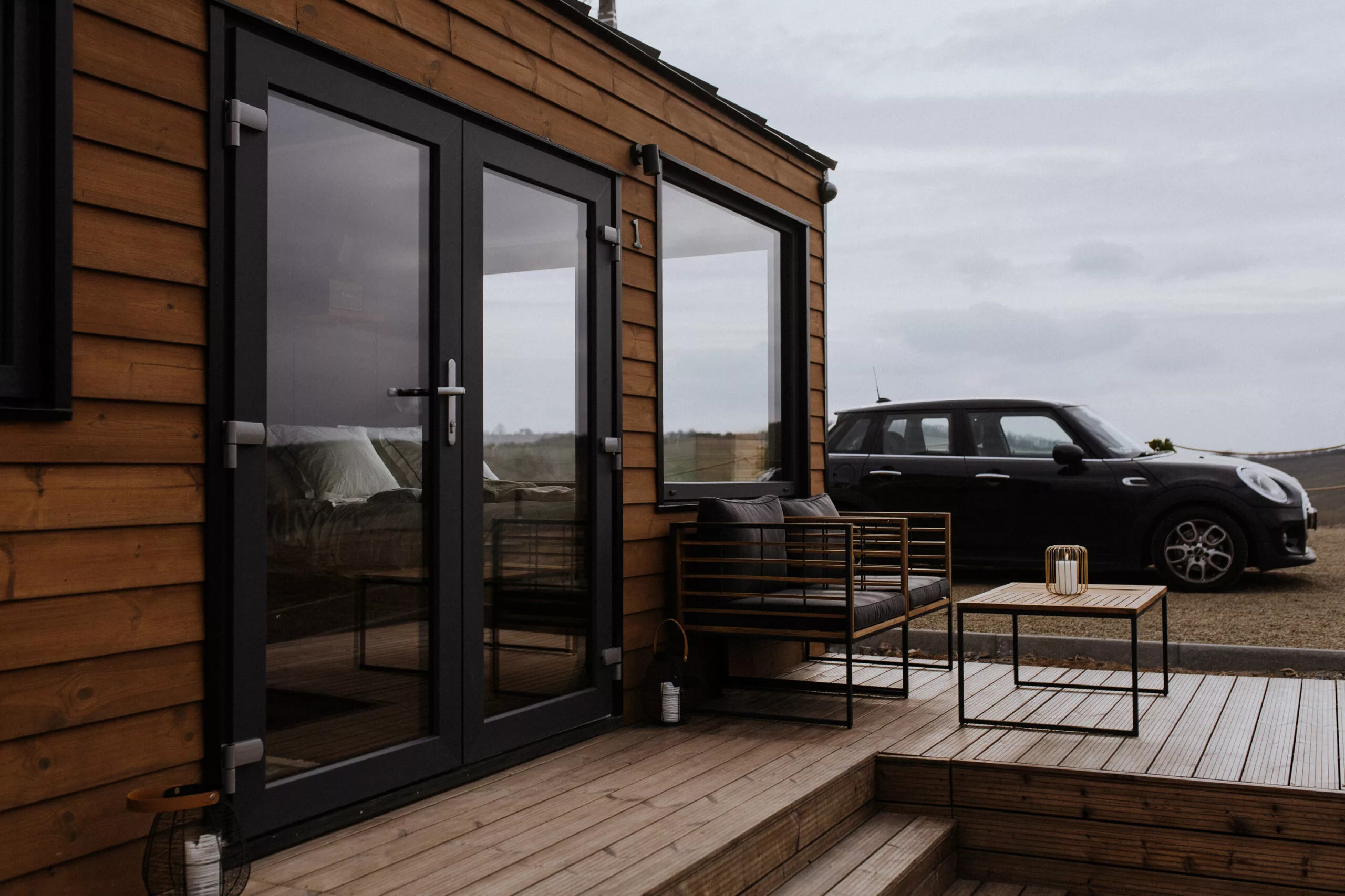 The Tiny Amsterdam is based on a double-axle trailer but is shown here semi-permanently installed with a deck area and a jacuzzi