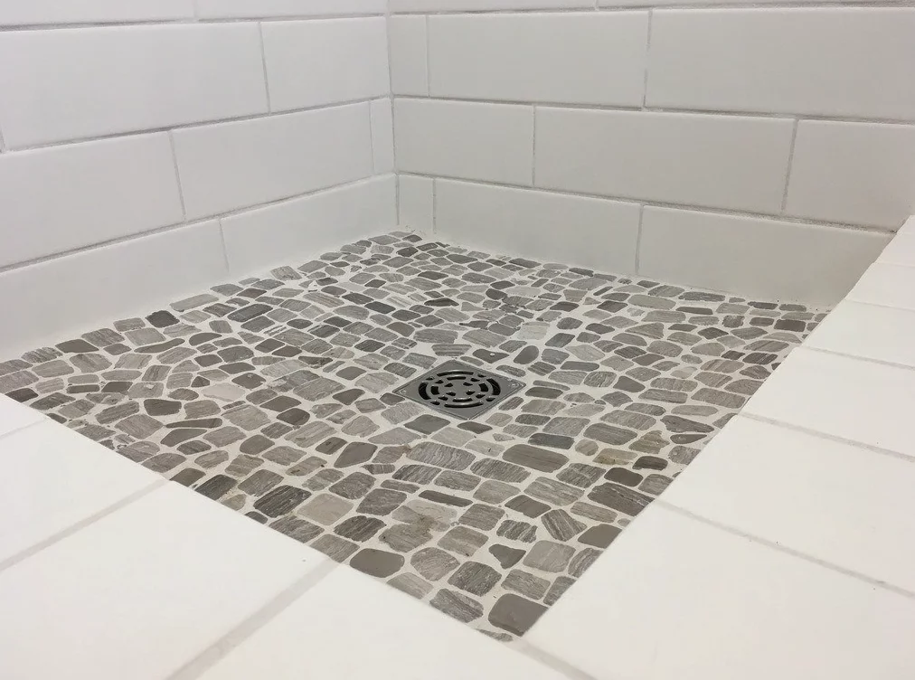 The intellectual Tiny Home's bathroom includes a full-sized shower