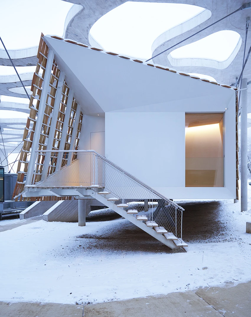 The design concept of the home was to create a cabin that would resemble a bird's nest resting amid the treetops"We designed the cabin like a nest with plenty of trees