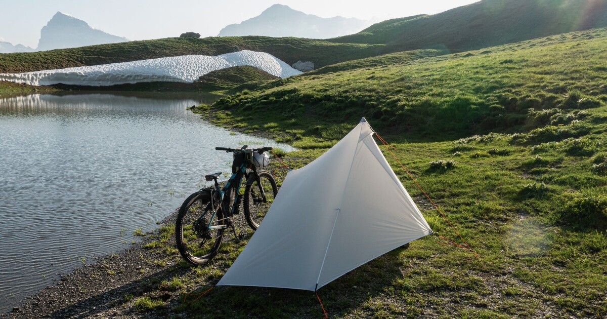 Compact bikepacking tent uses your bike for support Compact bikepacking tent uses your bike for support