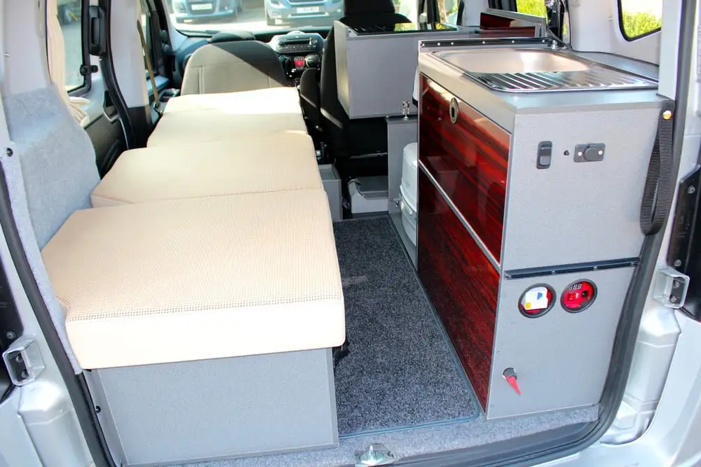 The Wheelhome Vikenze II includes a single-person bed, kitchen area and even toilet