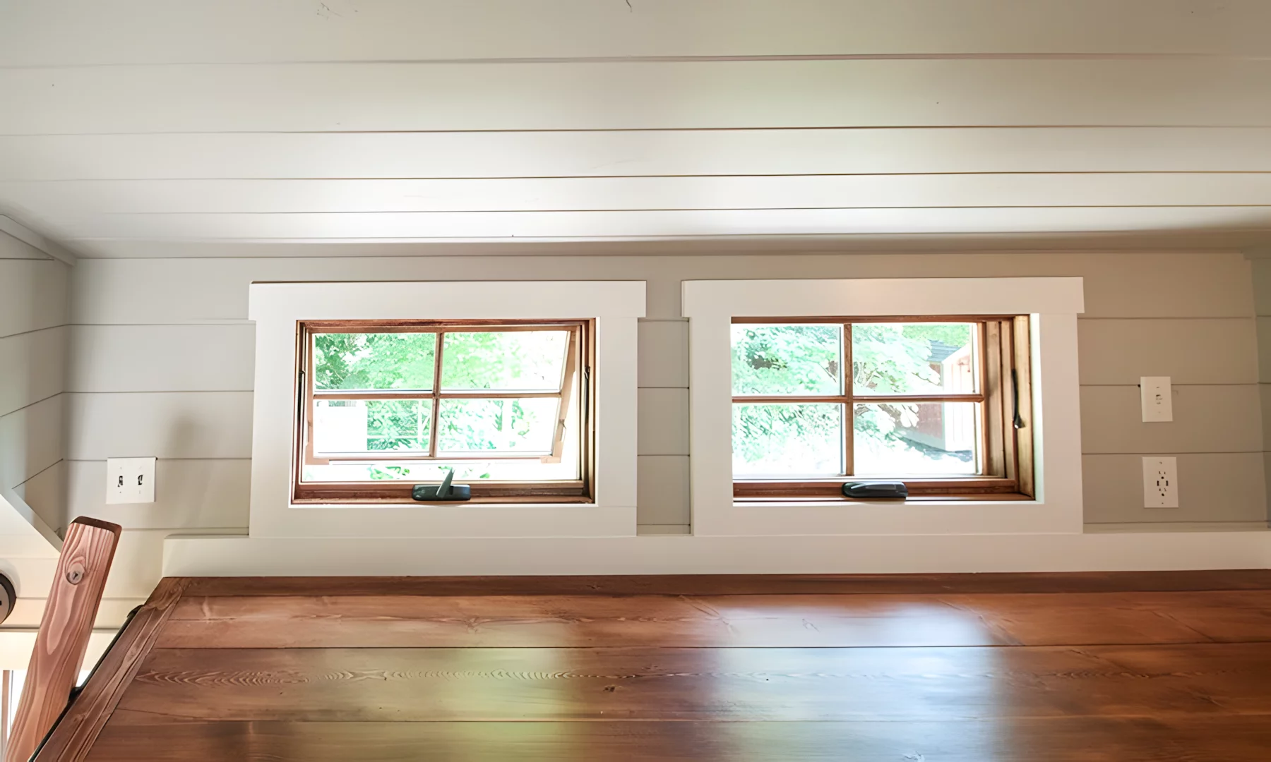 The Ynez's main loft is a typical tiny house bedroom with a low ceiling and space for a double bed