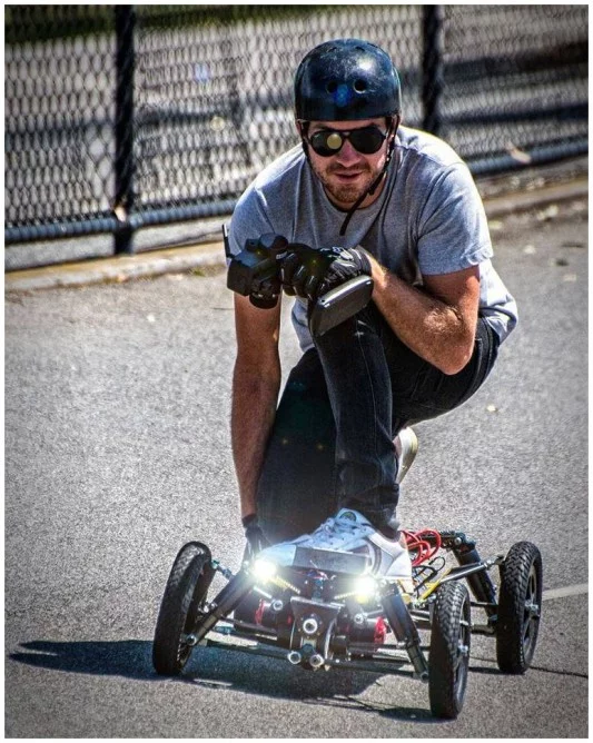 The BajaBoard includes an optional set of headlights and a wireless remote