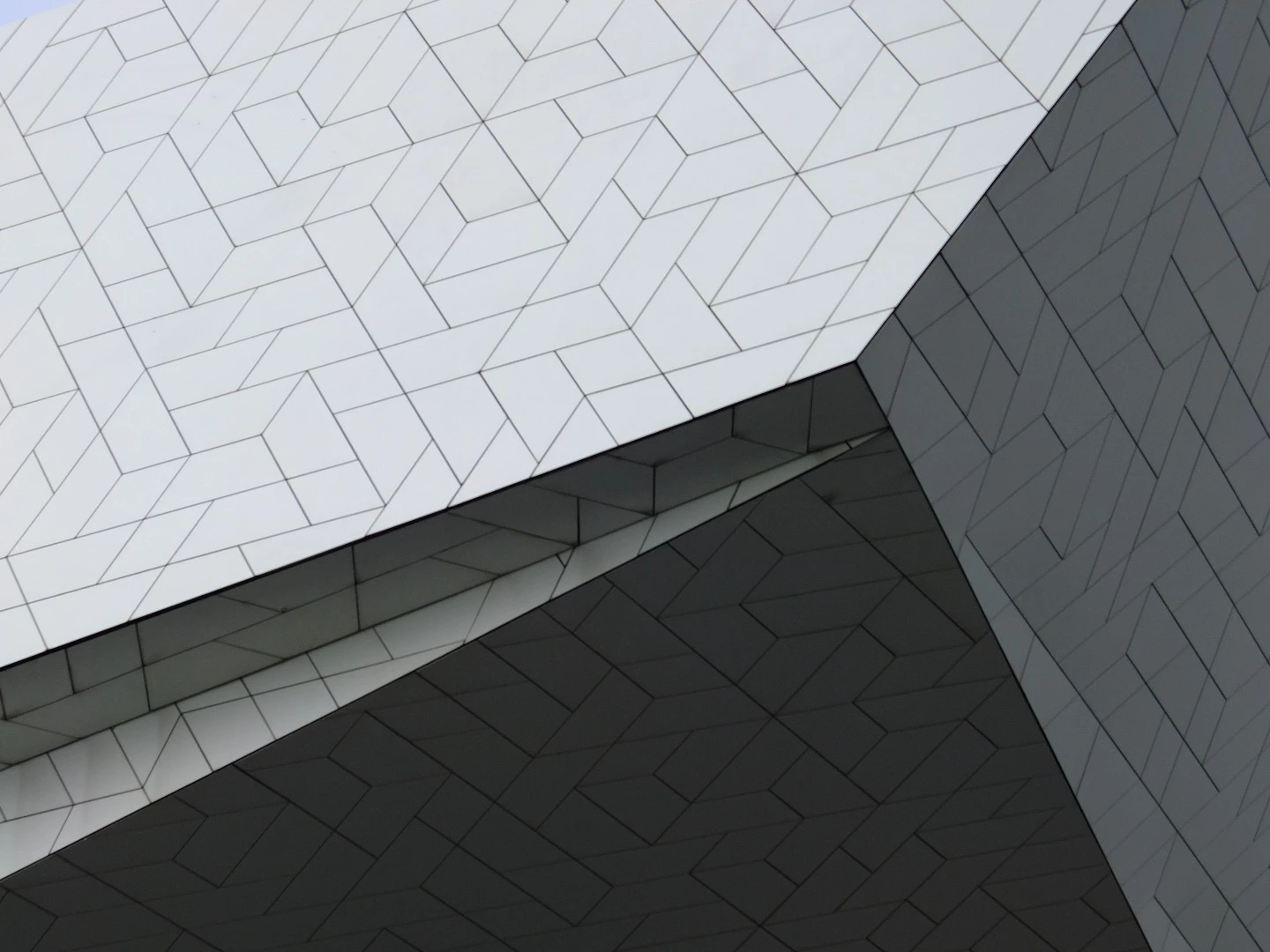Facade detail of the EYE Filmmuseum – Delugan Meissl Associated Architects. The facade is designed to reflect the changing light in interesting ways – a reference to film itself