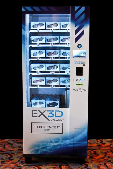The chosen scratch-resistant EX3D eyewear is dropped in the collecting bay on the swipe of a credit card