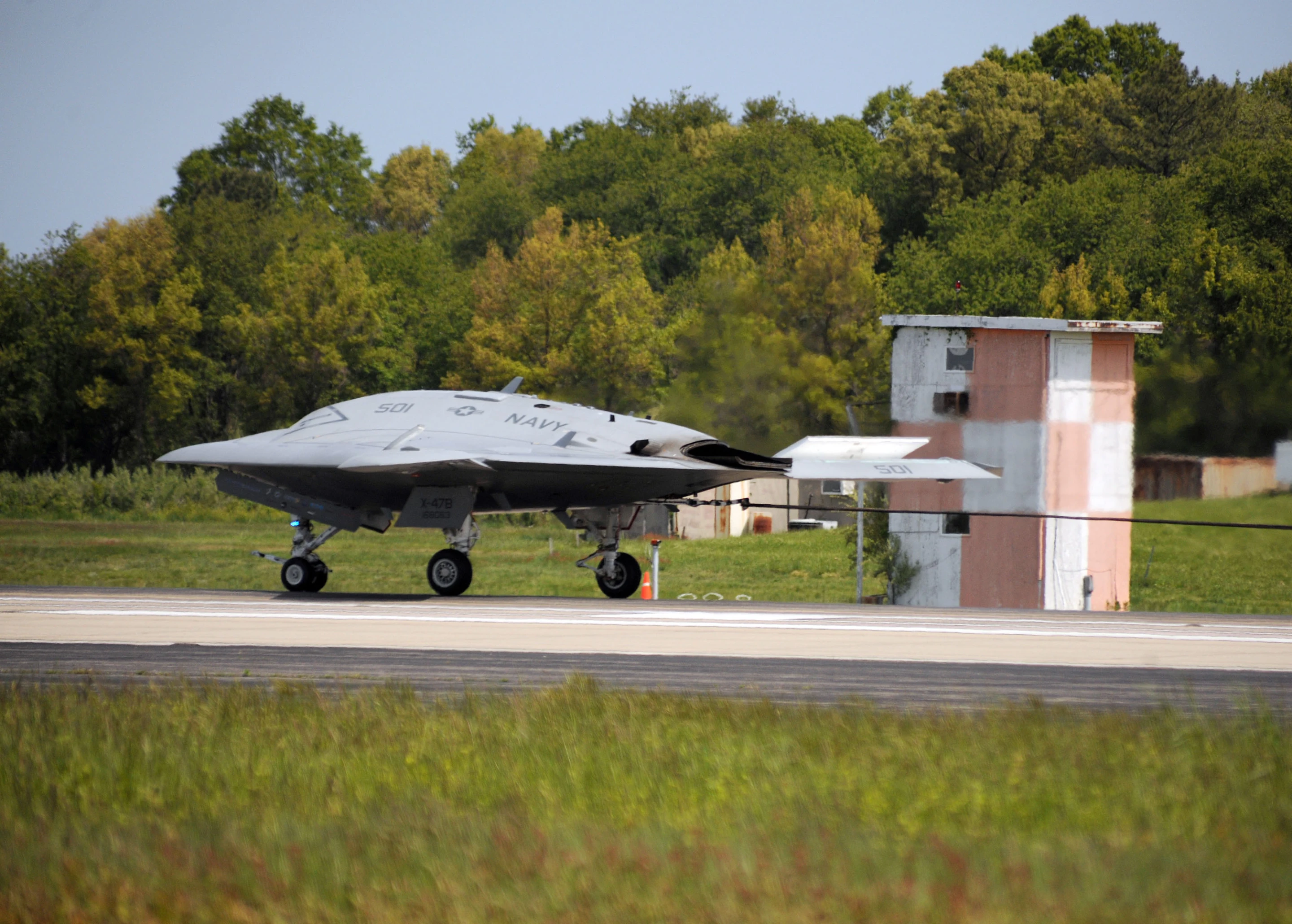 The X-47B being slowed to a halt by the cable system
