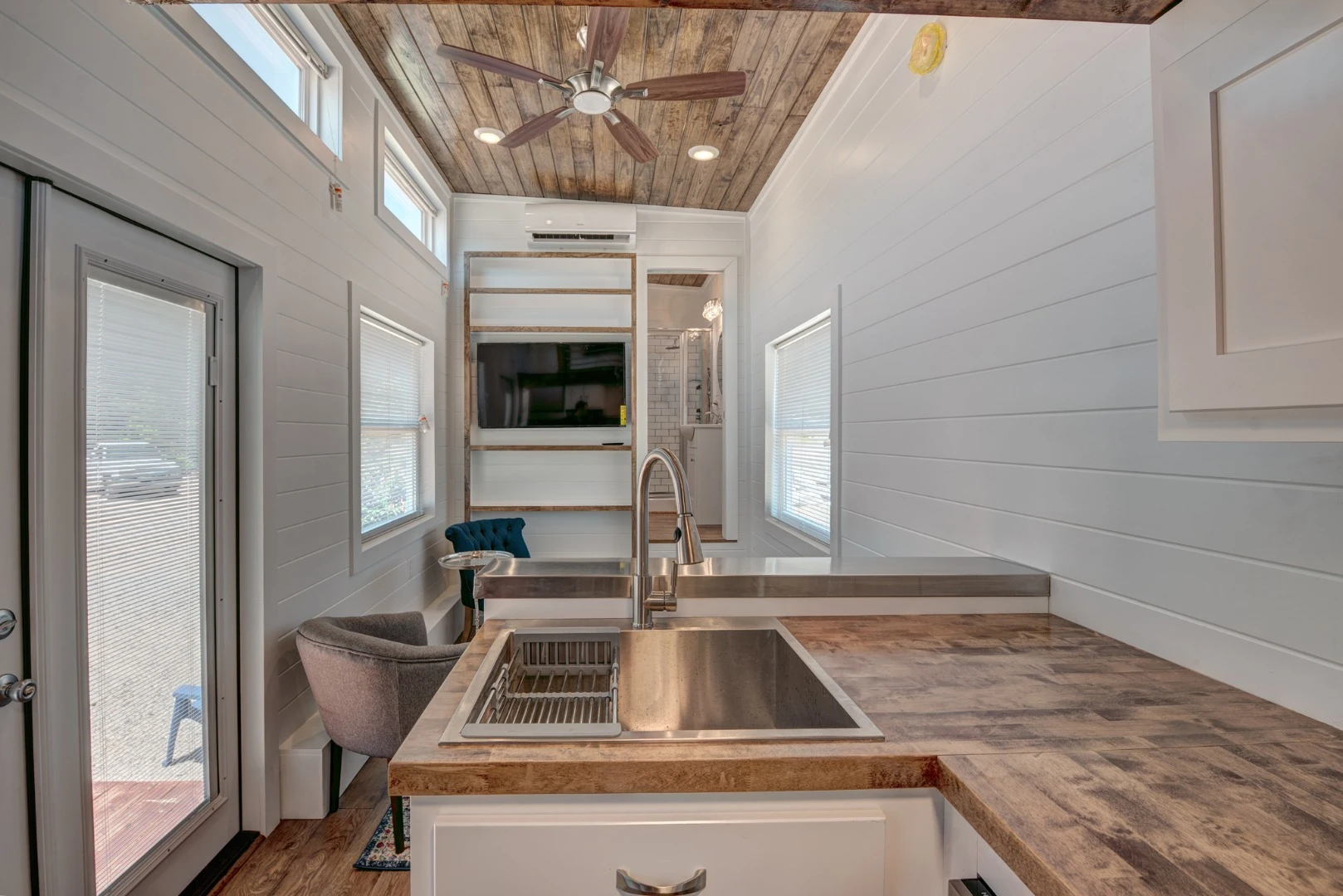 The high ceiling throughout the Journey tiny house gives this luxurious pint-sized dwelling a relatively spacious interior
