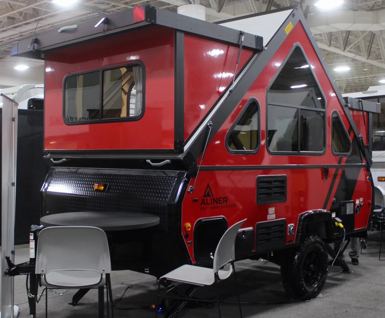 The new Aliner Family model adds some extra size and space to Aliner's line of A-frame-style trailers, sleeping four adults on a combination of regular and bunk beds