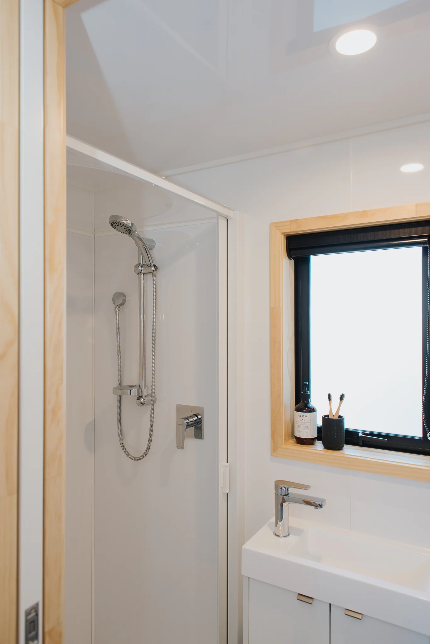 The Dreamweaver Tiny House's bathroom also has a shower and a sink