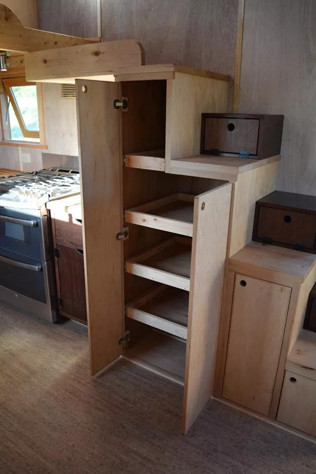 The tiny house features an equally tiny pantry