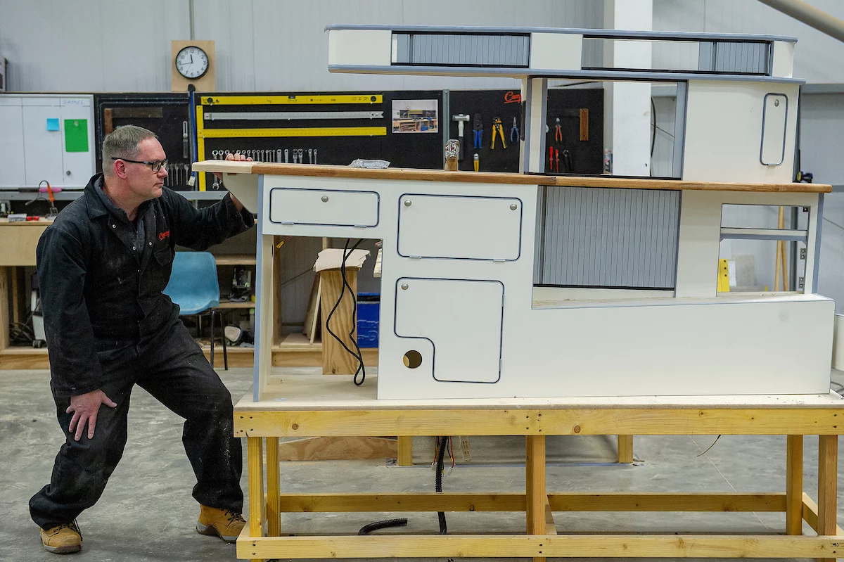 Campervan Co appears to still be finalizing the interior fit-out and does some work on the furniture here