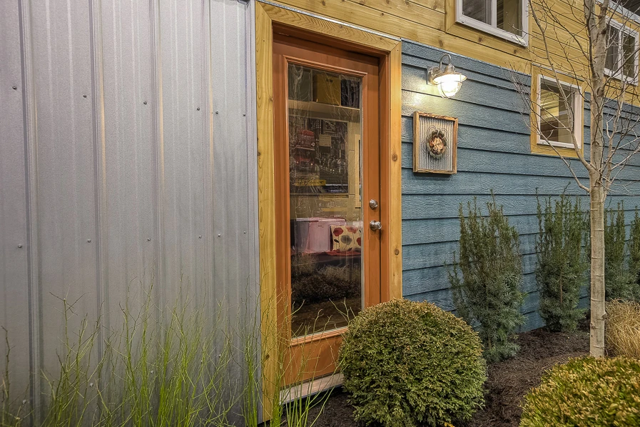 This container home is based on a large 40 ft (12 m) shipping container and has been raised by 30-in (76.2 cm)