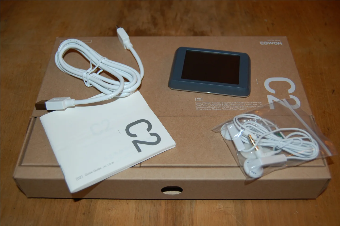 In the box: the Cowon C2, a USB cable, printed quick user guide, and some Cowon SE2 earphones