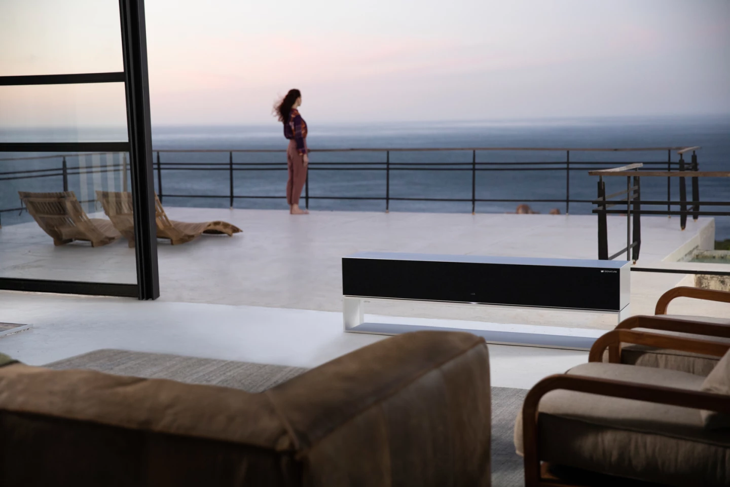When not in use, the LG Signature OLED R can roll up into its base out of sight
