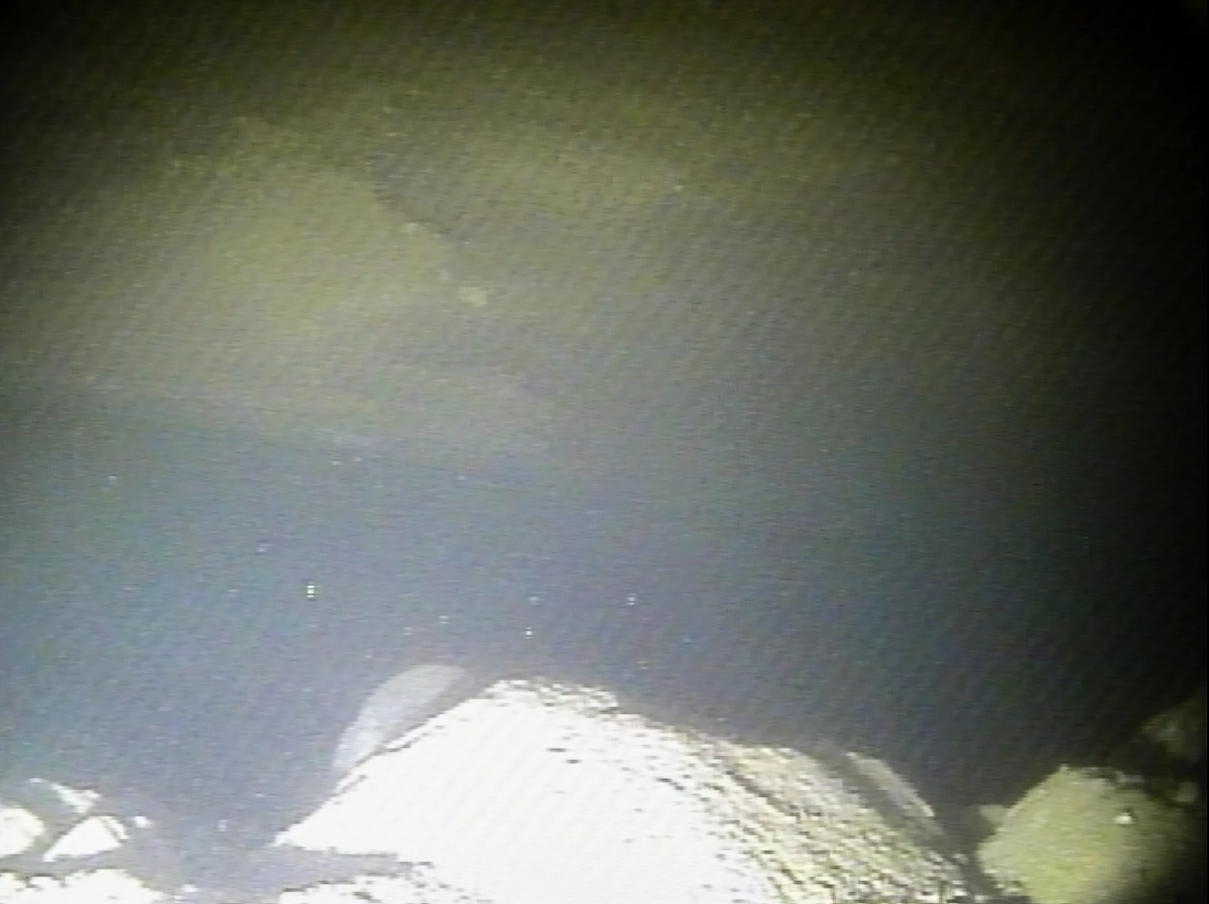 Faintly recognizable in the background is a section of Thwaites Glacier's grounding line, a zone pivotal to the glacier's stability or lack thereof and of the glacier's potential danger to sea-level rise