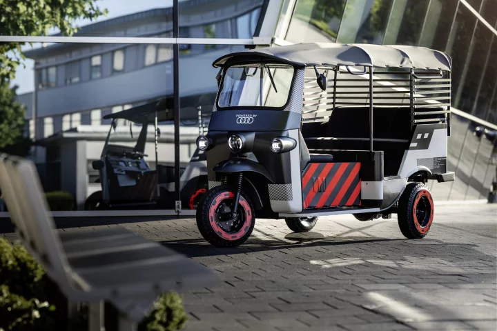 The brightly highlighted four ring-branded rickshaw is an experiment in battery recycling/reuse