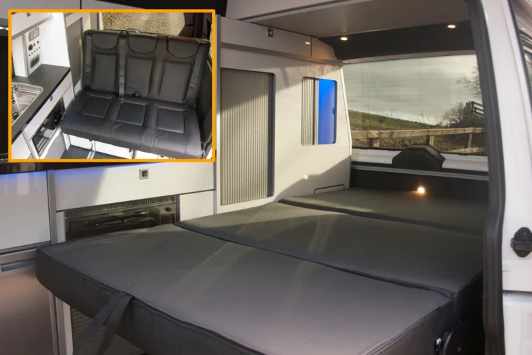 Volksleisure's three-seat rear-bench folds down into a two-person bed