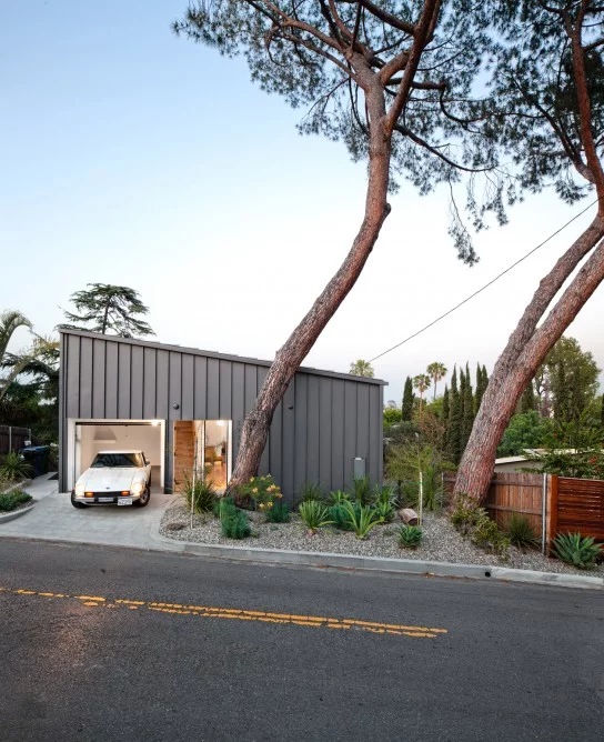 The single story (plus loft) property is asymmetric, making for a challenging interior layout