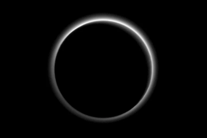 Backlit image of Pluto showing atmospheric haze