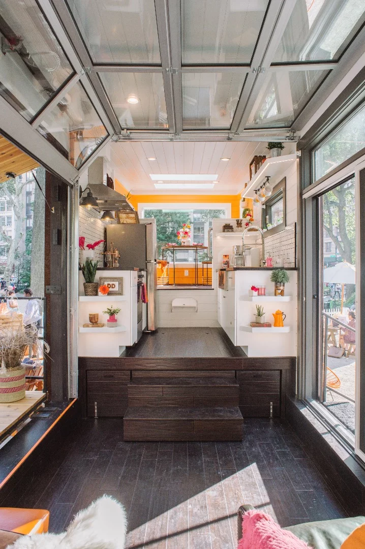 The Home That Runs on Dunkin' features underfloor storage in the main living area