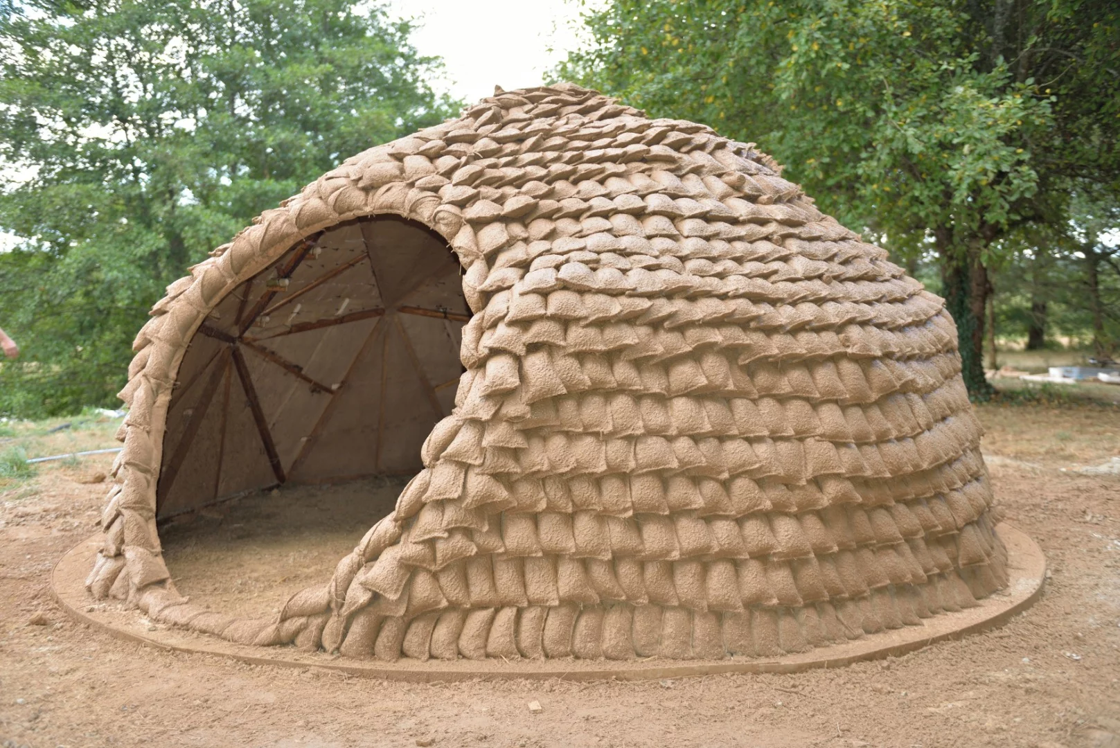 Researchers hope to fit drones with spraying hoses to apply layers of biomaterials onto light structures, such as geodesic dome frames or grid shells covered in tensile fabrics