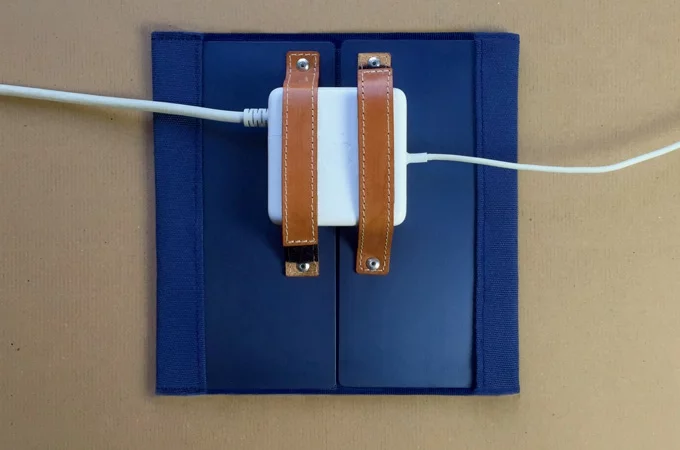 The Ye-T Warmpad's leather-backed Velcro straps are designed to fit almost any laptop charger