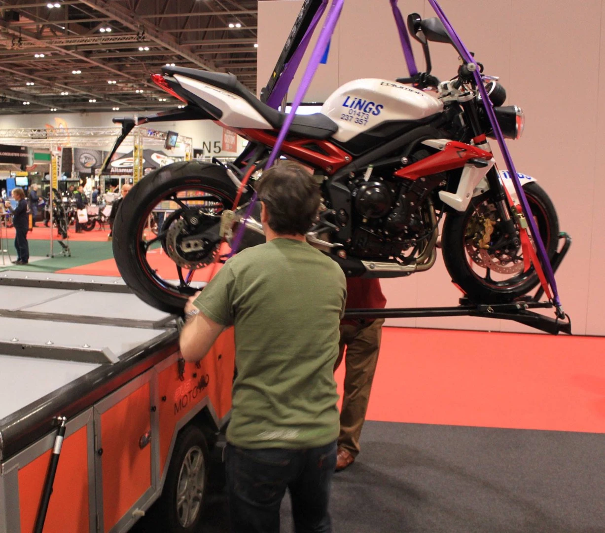 The winch-based lift system makes it easy to load two motorcycles