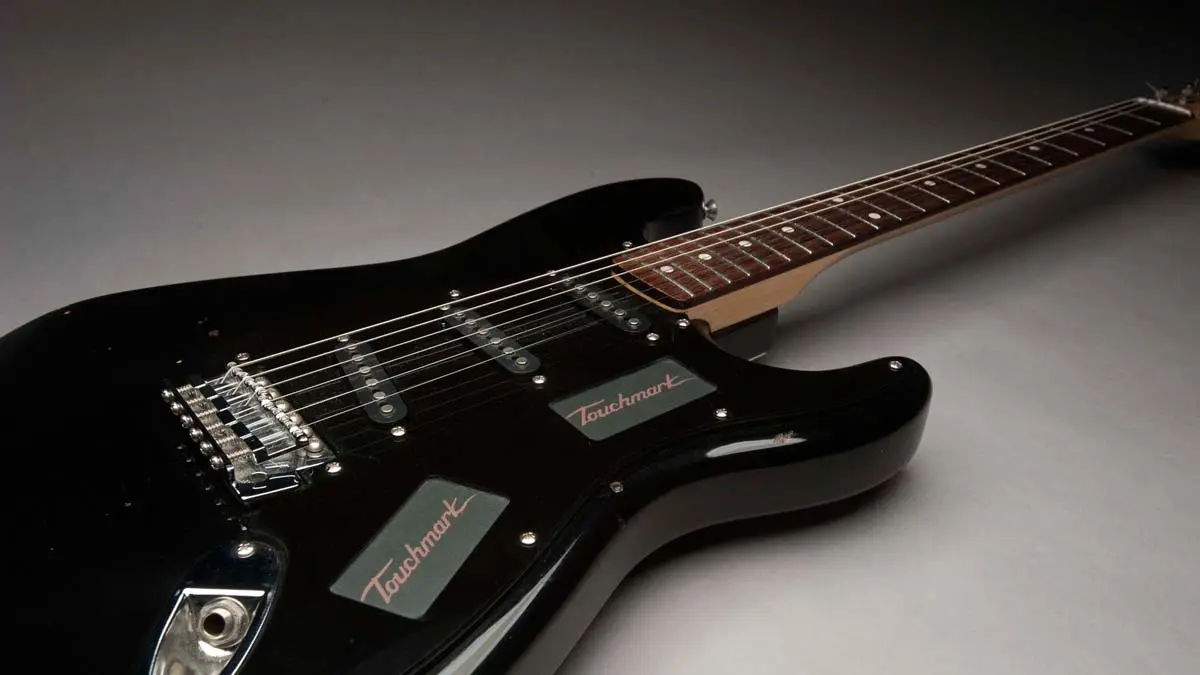 The Touchmark Interface System replaces the volume/tone knobs and pickup selector switch on an electric guitar with touch control panels
