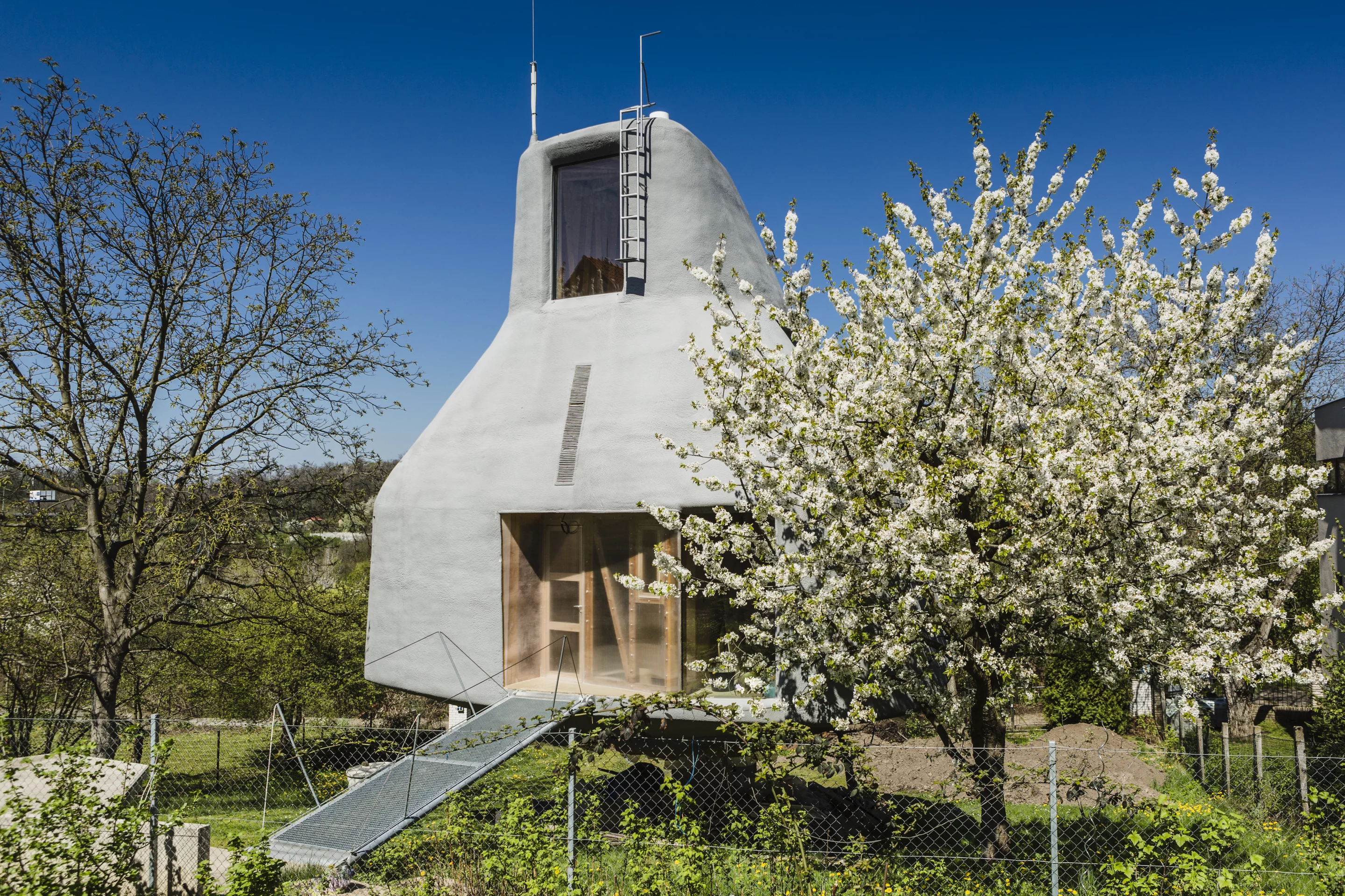 Access to the House in the Orchard is gained by footbridge