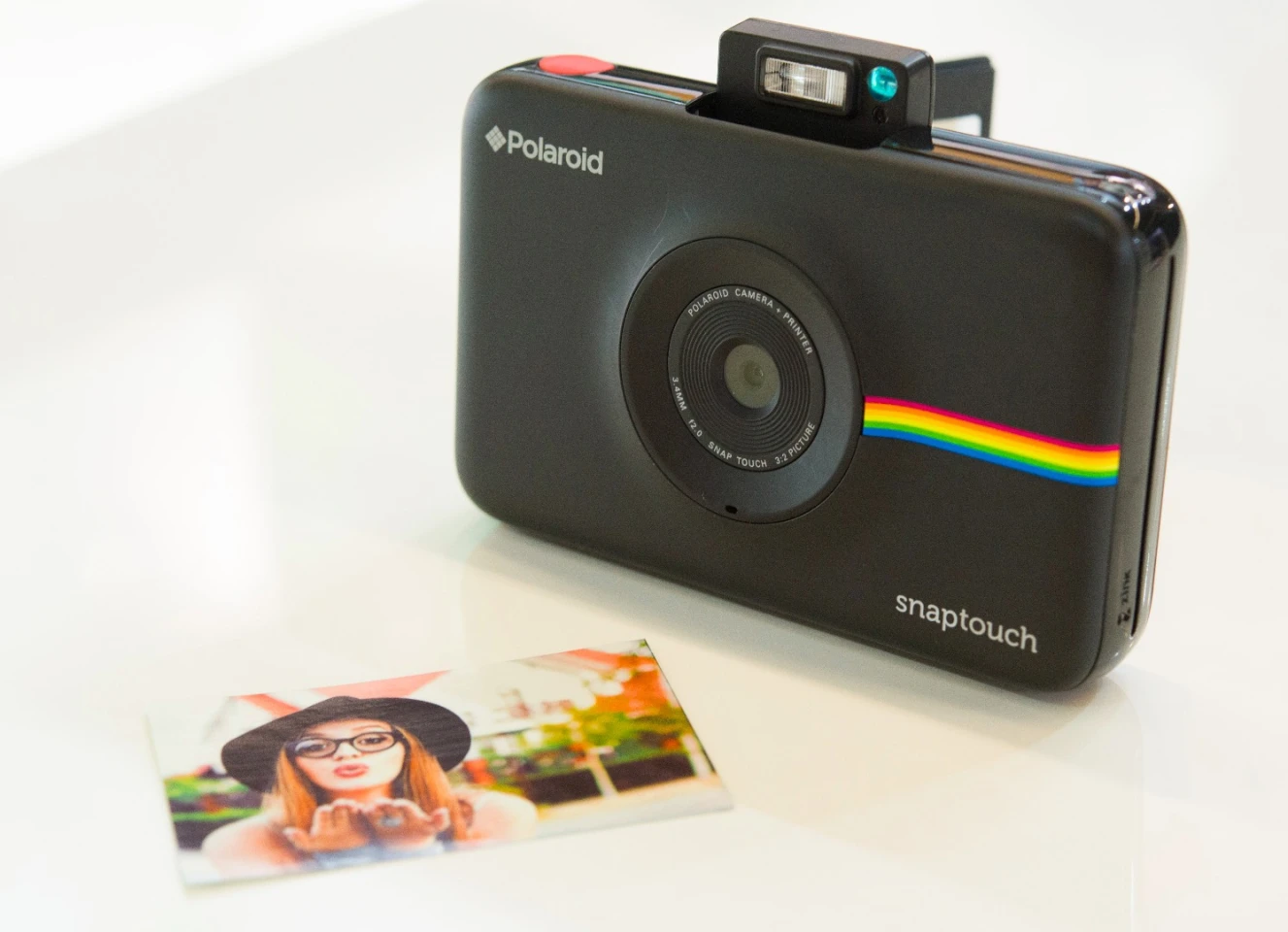 The Polaroid Snap Touch features a pop-up flash