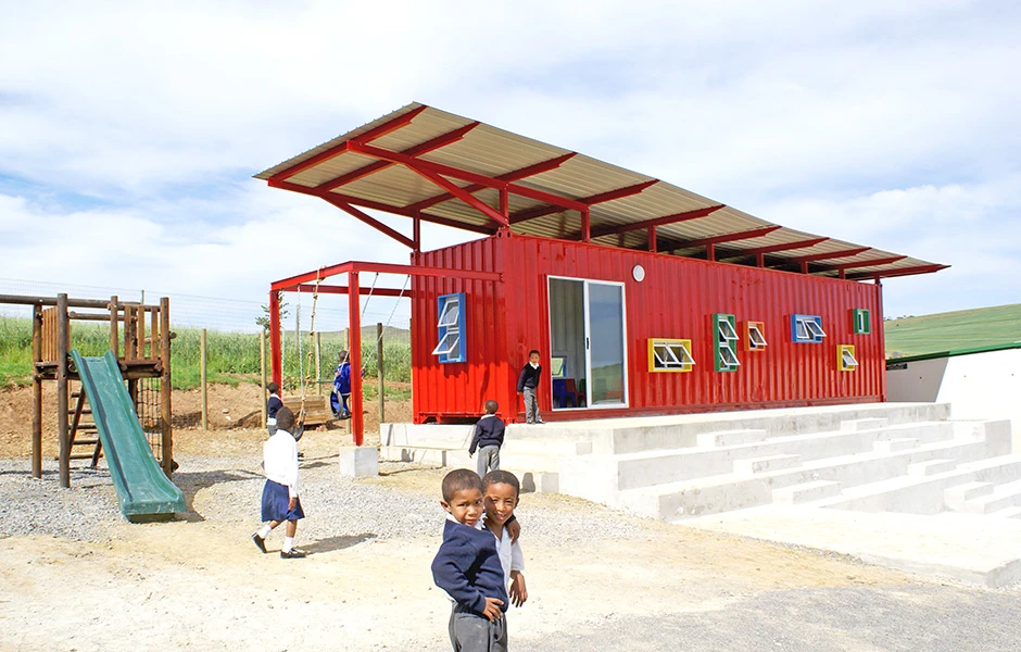 The most radical addition to the container is a horizontal solar shade - an expansive second roof above the container preventing solar radiation directly arriving at the classroom's outer surfaces thanks to the buffer of air between