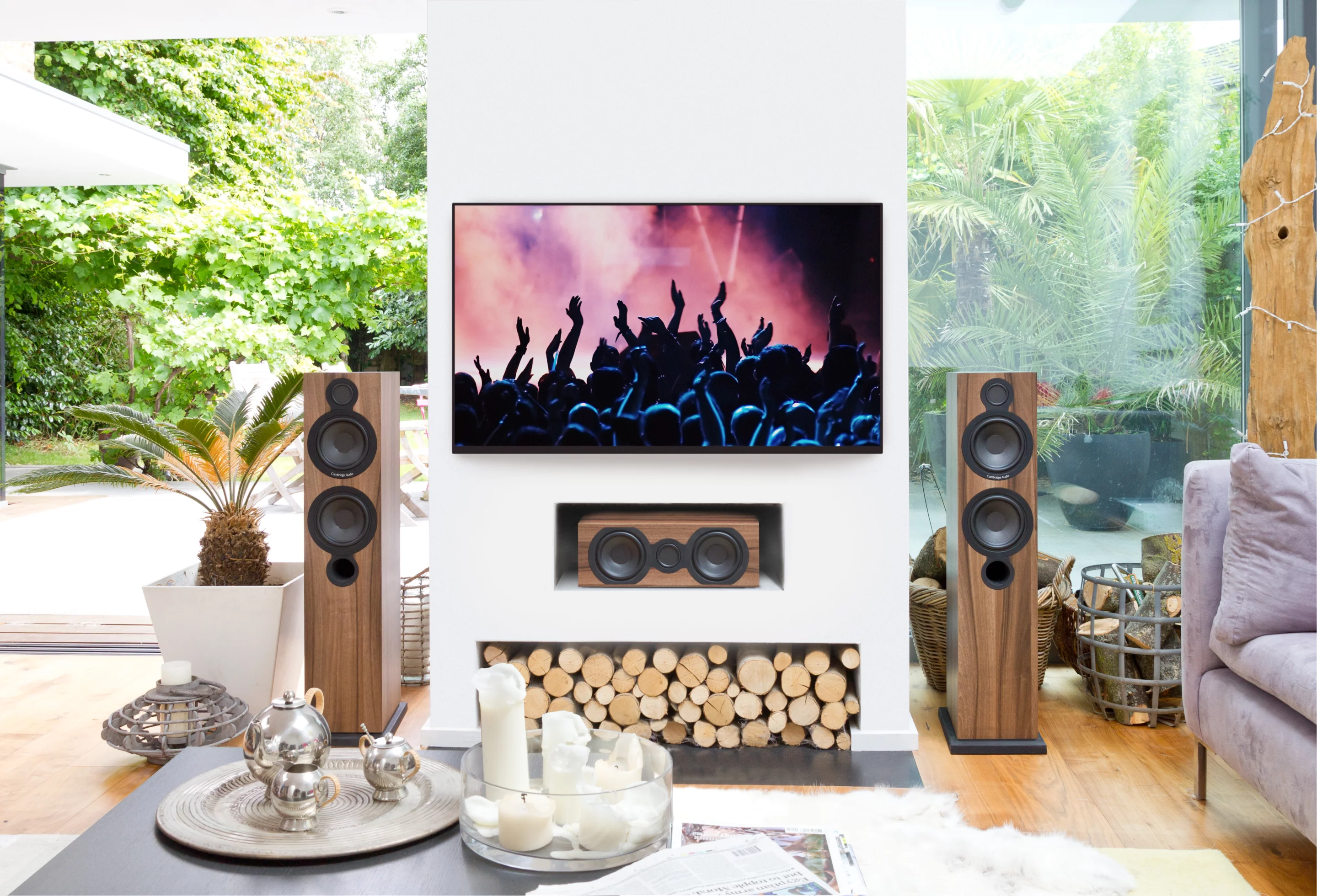 A combination of the Aero 6 floor-standing speakers and the Aero 5 center speaker in a room setting
