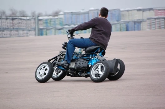 Thanks to its four-wheeled design and ingenious suspension system, which means it can go to full lean, complete with a rider, without falling over even at a standstill