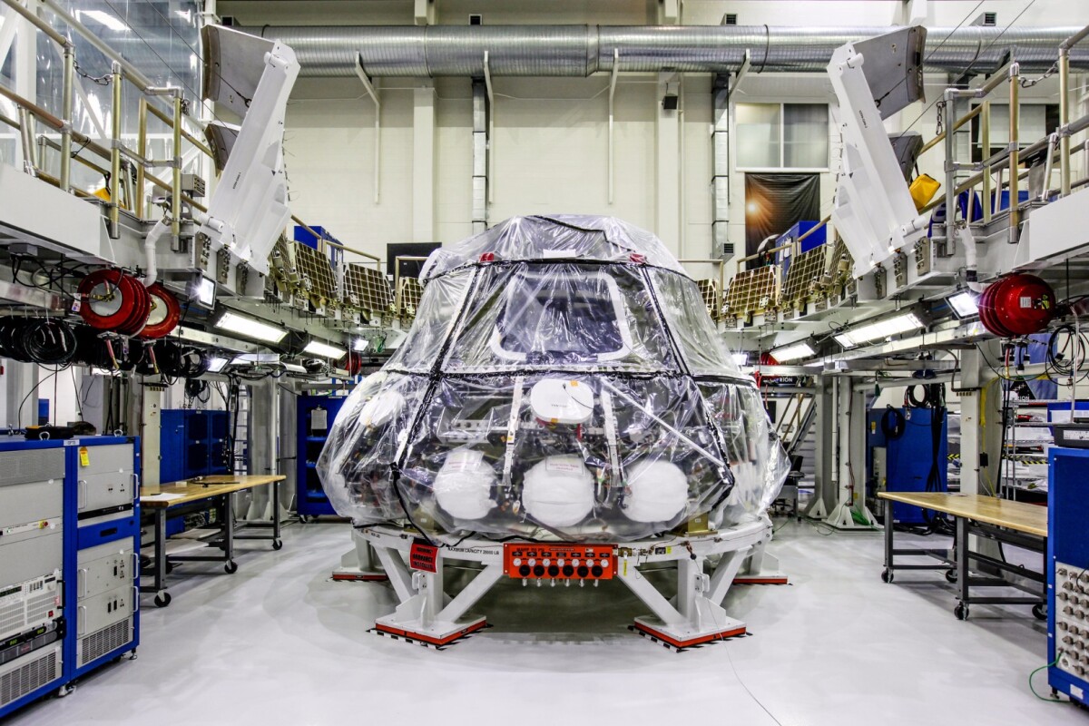 The Orion crew module for NASA’s Exploration Mission 1 (EM-1) is secured in a work station in the Neil Armstrong Operations and Checkout Building high bay at NASA’s Kennedy Space Center in Florida