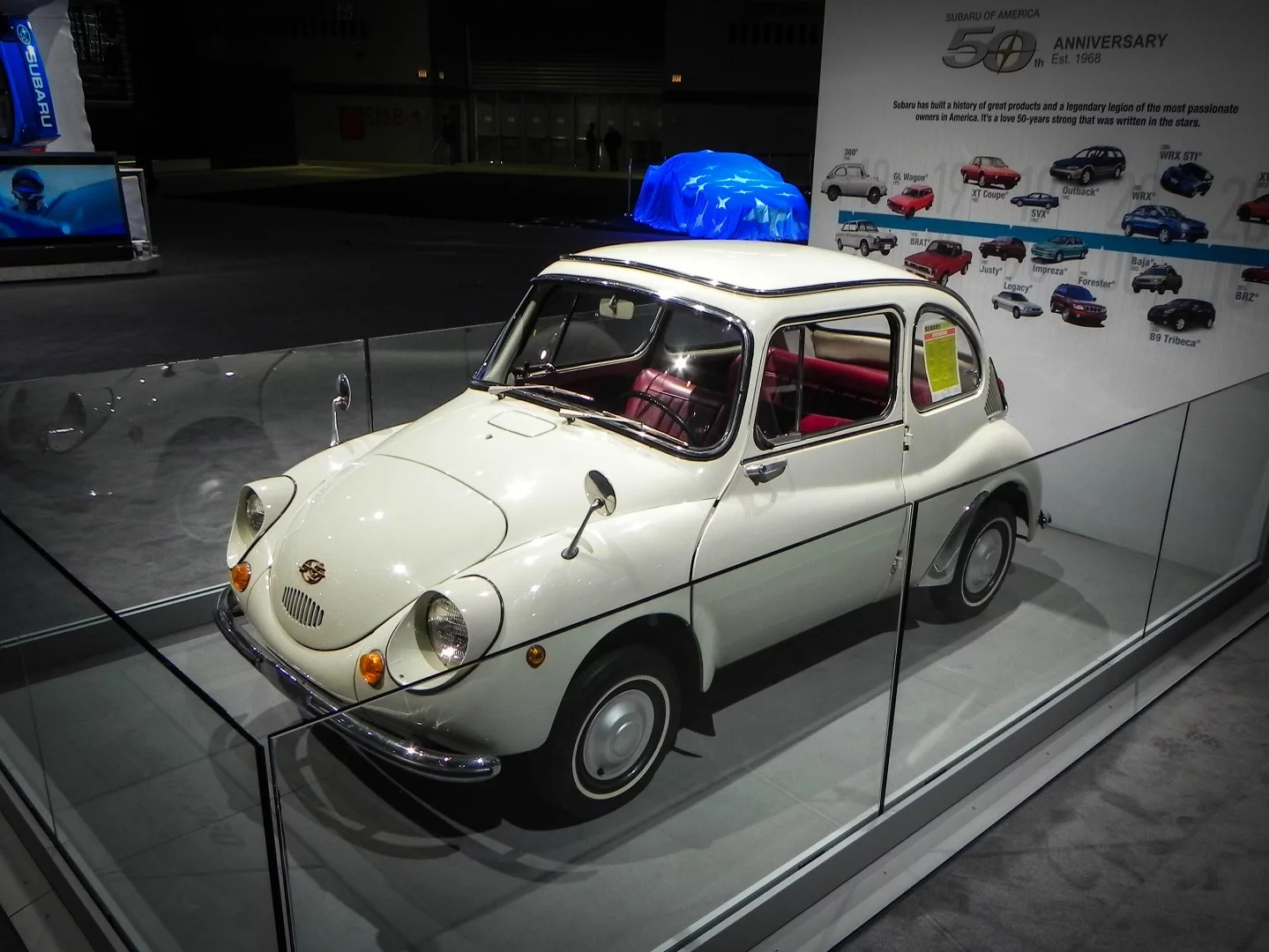 The 1968 Subaru 360, the company's first production vehicle, is on display at the Subaru booth in Chicago as the company celebrates 50 years