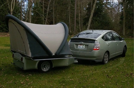 The Setzers have towed the ScarabRV by both bike and Prius
