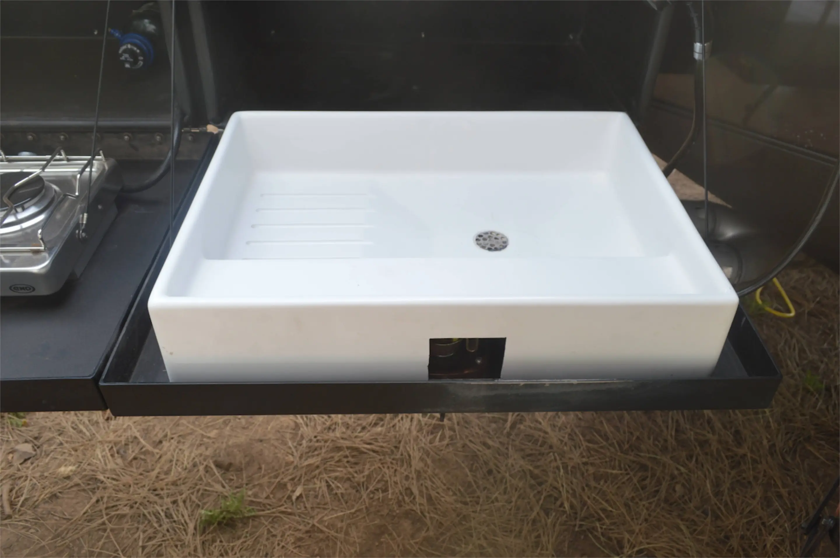 An external sink is part of the available outside kitchen