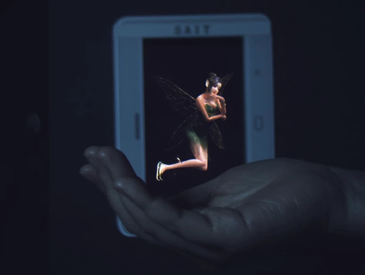 Thanks to Samsung's prototype hologram device, the fairy appears to be hovering in the hand – but in actuality she's displayed on the screen in the background