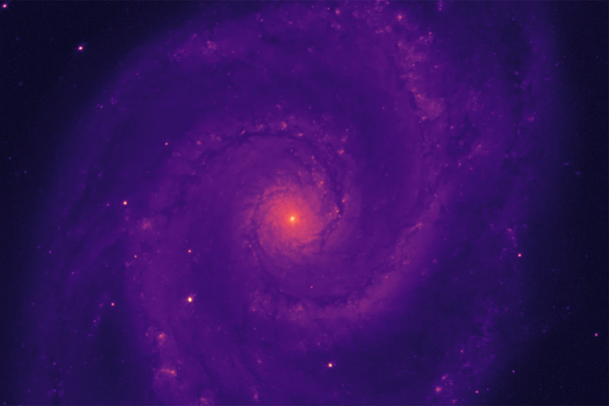 The "first light" image taken by the Dark Energy Spectroscopic Instrument (DESI), showing the red light of the Whirlpool Galaxy