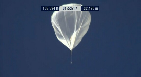 Telephoto image of the Red Bull Stratos balloon and capsule as it passes an altitude of 20 miles (32.5 km)