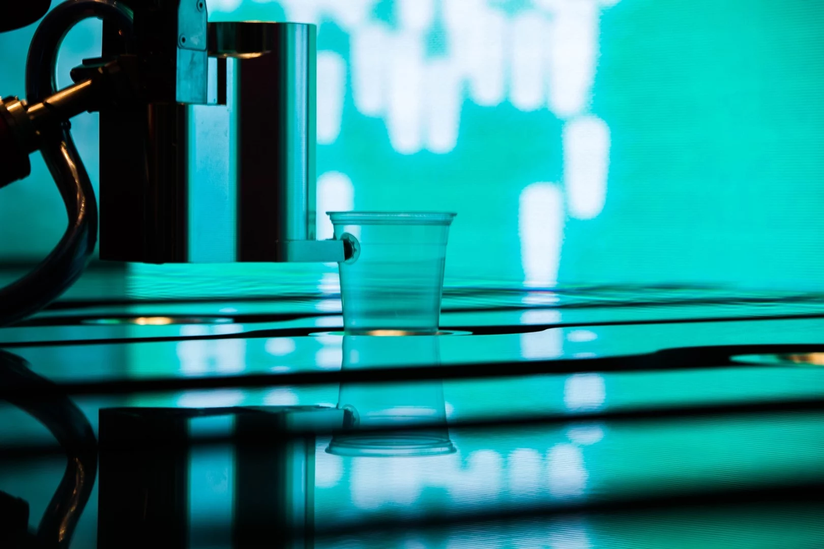 The robots fetch glasses, pour measure from optics and shake the cocktails